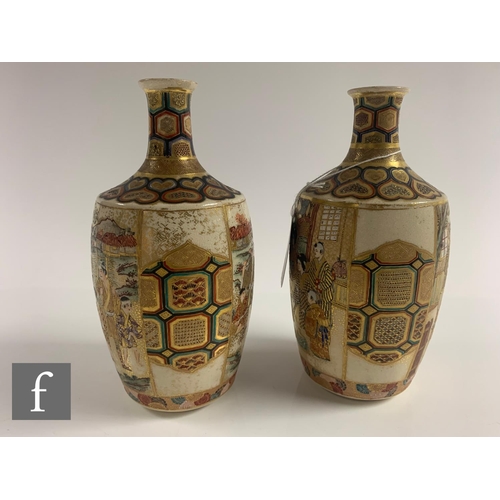 27 - A pair of Japanese satsuma vases, each of bottle form, the body of each with opposing mirror images,... 