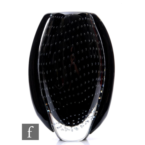 321 - A 20th Century glass vase of compressed ovoid form with applied side stripes in black over a cased c... 