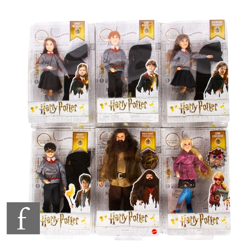 245 - Six Mattel Harry Potter dolls, comprising Luna Lovegood, Rubeus Hagrid, Harry Potter, Hermione Grang... 