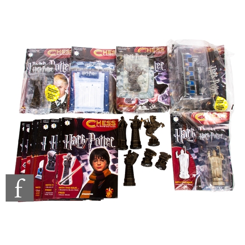 257 - A DeAgostini Harry Potter Chess set, a collection of partwork magazines and related pieces. PLEASE V... 