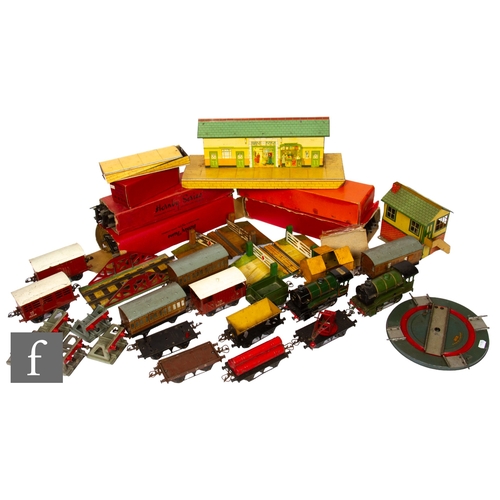 351 - A collection of O gauge Hornby model railway, to include two clockwork locomotives, 0-4-0 green 1842... 