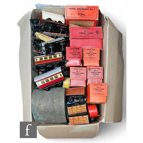 373 - A collection of O gauge Hornby items, to include boxed and unboxed buildings and accessories includi... 