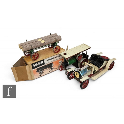 414 - Three Mamod live steam items, an unboxed limousine, an unboxed tractor and a boxed lumber wagon. (3)... 