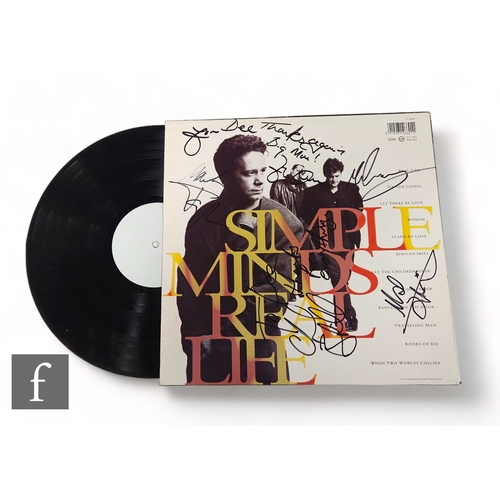 33 - Simple Minds - A signed Real Life LP, signed by band members and dedicated 'For Dee Thanks Again Big... 