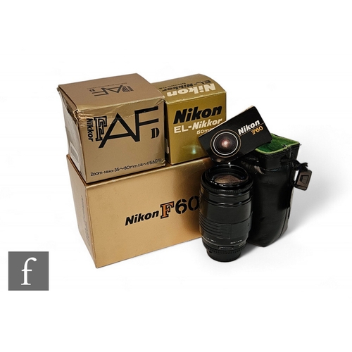 209 - A Nikon F60, new in box, together with three Nikon lenses, including AFD 35-80mm f4-5.6, Nikkor 50mm... 