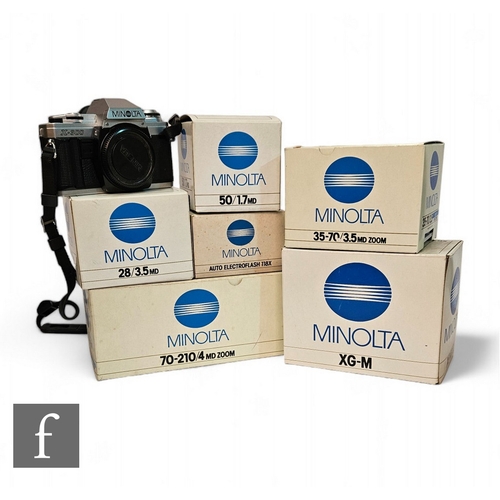 211 - Various Minolta cameras and accessories, to include X-300, XG-M and boxed lenses including f28/3.5, ... 