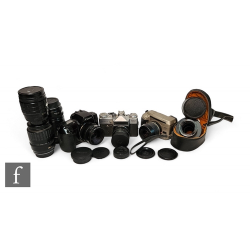 214 - A collection of cameras and lenses, to include a Canon EOS 10, with 24mm f2.8 lens, Zenit-E, Minolta... 