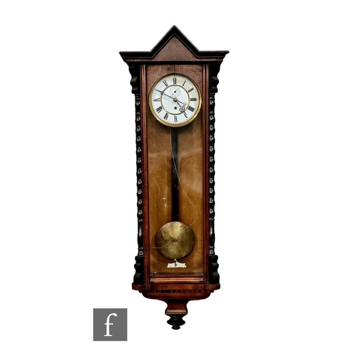 1102 - A 19th Century Vienna regulator wall clock, the single weight driven movement enclosed by a glazed d... 