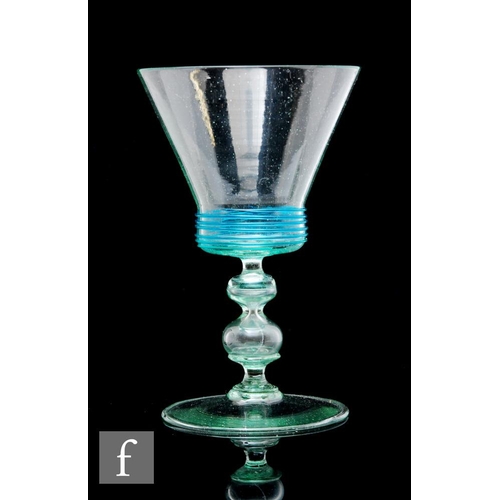 363 - A late 19th Century Italian Murano drinking glass, the conical bowl decorated with fine blue threadi... 