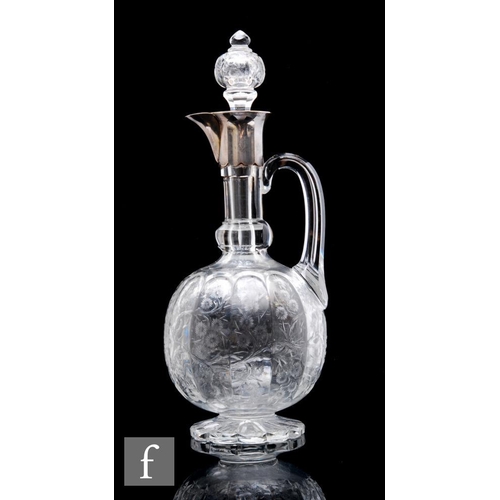 394 - A late 19th Century Stevens & Williams clear cut crystal glass claret jug, the petal edged foot ... 