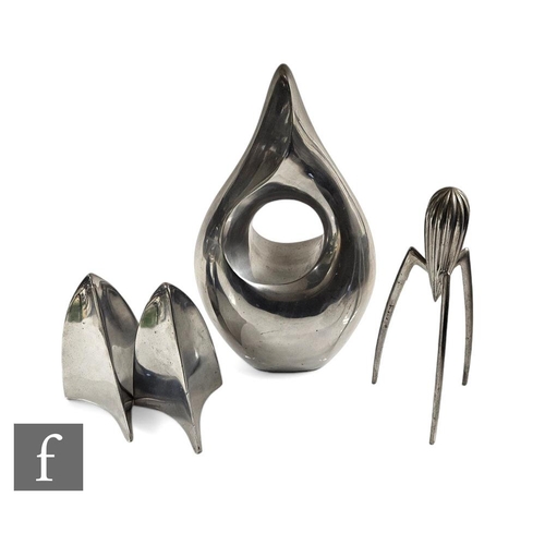 522 - A 20th Century aluminium abstract geometric vase, height 39cm, a pair of similar plane bookends and ... 