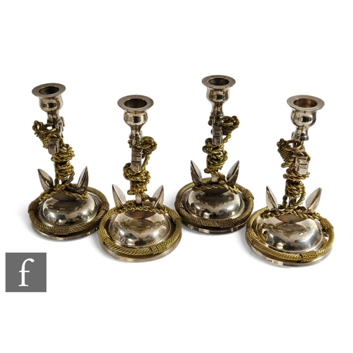 526 - A set of four 20th Century or earlier plated candlesticks, each in the form of an anchor within a tw... 