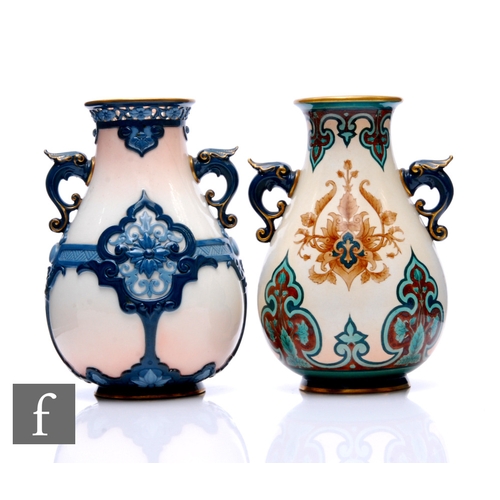 11 - A Hadley's Worcester vase of twin handled baluster form, enamelled in tonal blue, reticulated rim wi... 