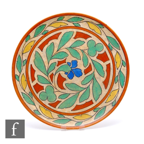 28 - A 1930s Burleigh Ware charger, decorated by Harold Bennett with stylised leaves and foliage over a s... 