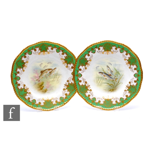 29 - A pair of early 20th Century Coalport cabinet plates with hand painted roundels, signed P Simpson an... 