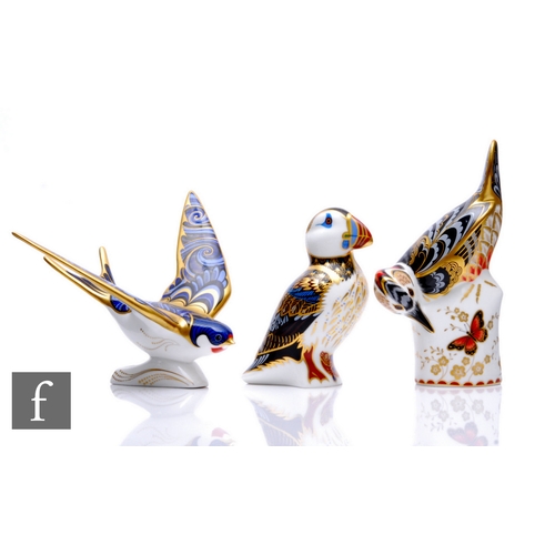 44 - Three Royal Crown Derby paperweights, to include a great spotted woodpecker, height 16.5cm, a puffin... 