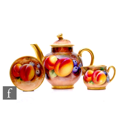 83 - A Royal Worcester fruit painted three piece miniature teaset by Frank Roberts, circa 1954, decorated... 