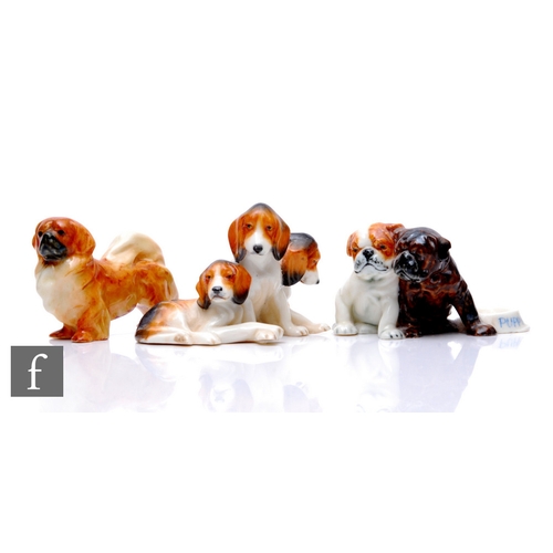 84 - A Royal Worcester figure group, Fox Terrier Puppies, modelled by Doris Lindner, circa 1935, height 5... 