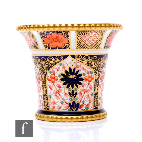 86 - A Royal Crown Derby Old Imari pattern cache pot of flared form, with beaded rim and foot rim, printe... 