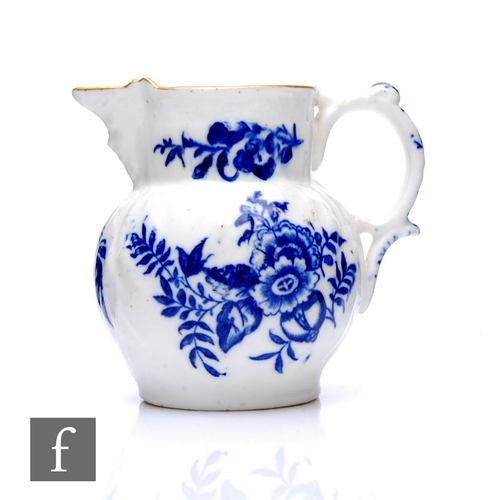 87 - A Worcester style blue and white cabbage leaf mask jug, circa 1770, decorated with roses, floral spr... 