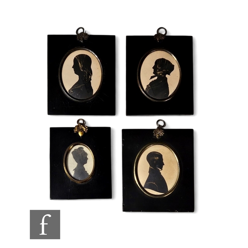 482 - Four 19th Century silhouettes of a young gentleman and three ladies, one wearing a bonnet, heightene... 