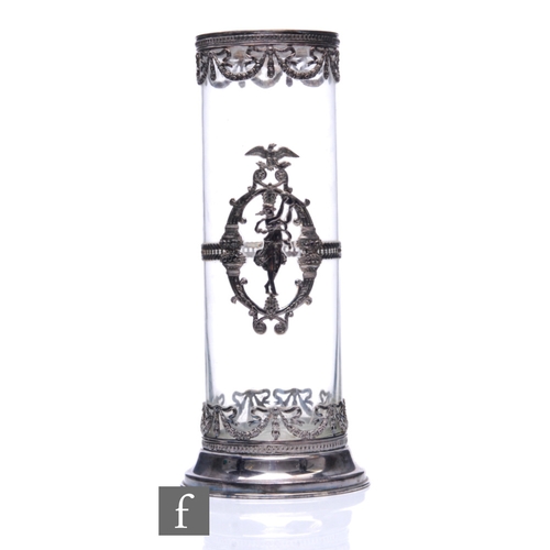 486 - A 20th Century cylindrical clear glass vase, mounted with a classical dancing figure below and above... 