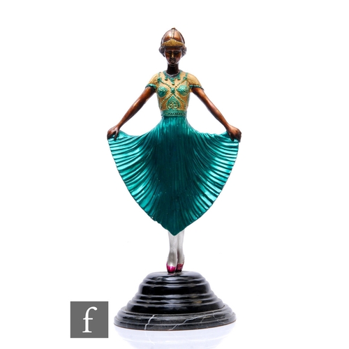 492 - A late 20th Century painted bronze Art Deco figure of a ballerina holding and wearing a green dress ... 