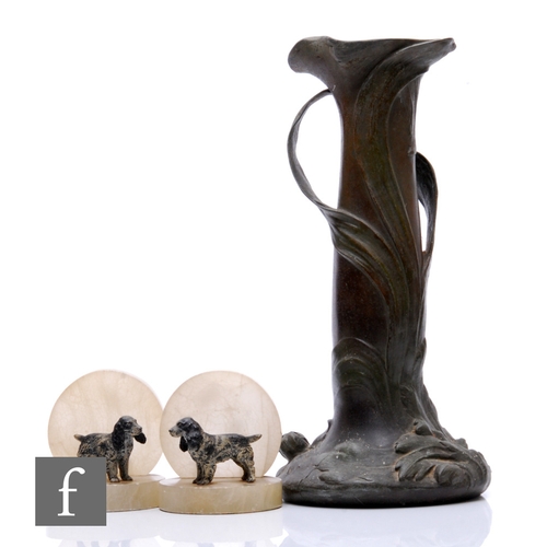 500 - A pair of 1930s alabaster bookends, each mounted with a Scottie dog, and an Art Nouveau pewter vase ... 