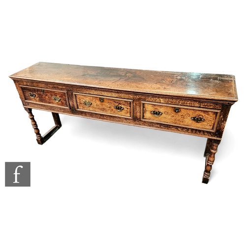 636 - An 18th Century oak dresser, fitted with three moulded front edged drawers, below a moulded edge top... 