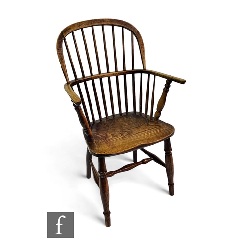 645 - A late 19th to early 20th Century ash and elm Windsor elbow chair on turned splayed legs.PLEASE VIEW... 