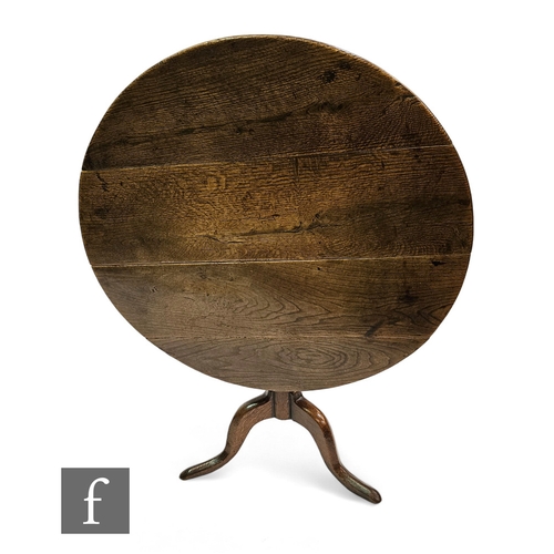 646 - A George III country circular oak tripod occasional table, diameter 85cm.PLEASE VIEW CONDITION REPOR... 