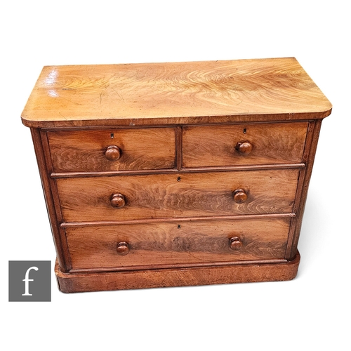 650 - A Victorian mahogany straight front chest of two short and two long drawers, turned wood handles on ... 