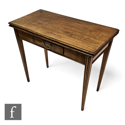 654 - A 19th Century mahogany fold over tea table, fitted with a small drawer, on square moulded tapering ... 