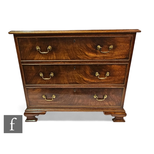 655 - A George III mahogany straight front chest of three long graduated drawers below a moulded edge top,... 