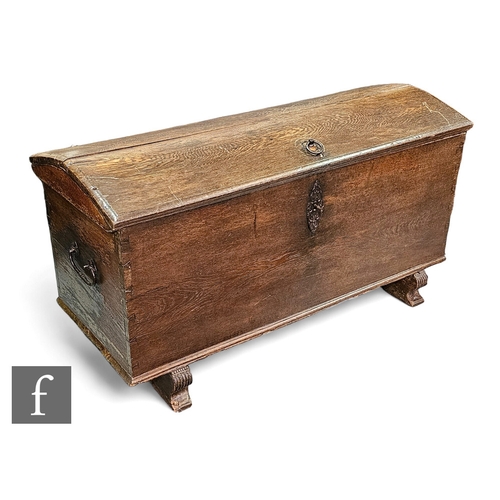 669 - A large 19th Century continental oak domed blanket/storage chest, two handles, iron fittings with ke... 