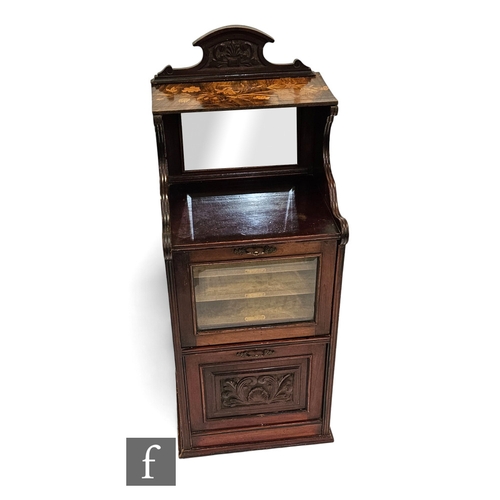 676 - A Victorian mahogany music cabinet fitted with three drawers and a pull down cupboard below a later ... 