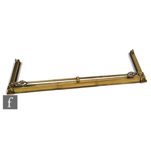 687 - An Edwardian style brass fender, scroll mounts united by a bar, length 140cm.PLEASE VIEW CONDITION R... 