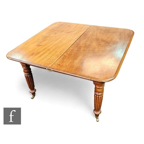 694 - A Victorian extending mahogany dining table, the moulded edge top over a plain frieze on turned reed... 