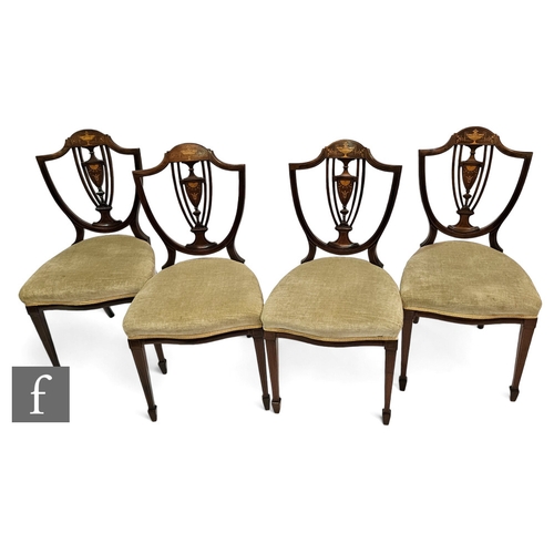 695 - A set of four Sheraton revival marquetry inlaid drawing room chairs, the shield shaped back on squar... 