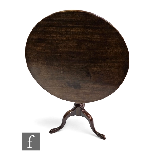 701 - A George III circular mahogany tilt top tripod occasional table on splayed legs, diameter 76cm.PLEAS... 