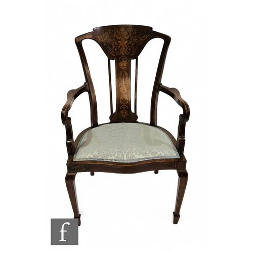 710 - An Edwardian marquetry inlaid mahogany elbow chair, the shaped back detailed with acanthus decoratio... 