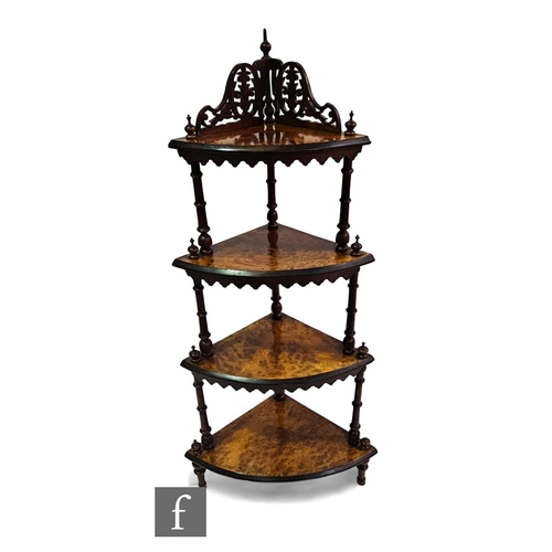 719 - A Victorian mahogany three figured walnut four tier corner whatnot, each with a shaped apron and tur... 