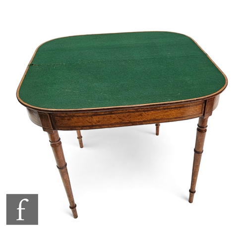 721 - A Regency satinwood demi lune fold over card table, the line inlaid top over a crossbanded frieze on... 