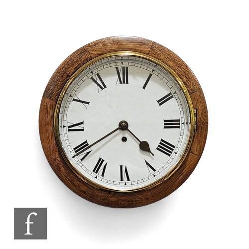 627 - An early 20th Century oak cased circular schoolroom clock, single fusee movement, width 39cm.PLEASE ... 