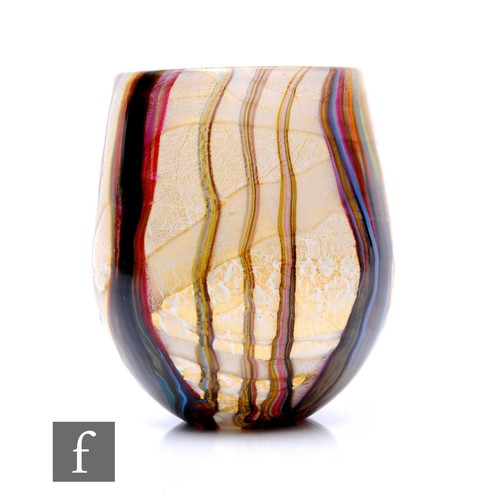 174 - A 20th Century Jonathon Harris studio glass vase, with polychrome organic reeded stripes over cased ... 