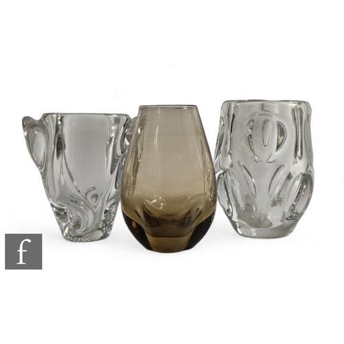 1136 - A 20th Century continental clear crystal glass vase of ovoid form with dimpled decoration, together ... 