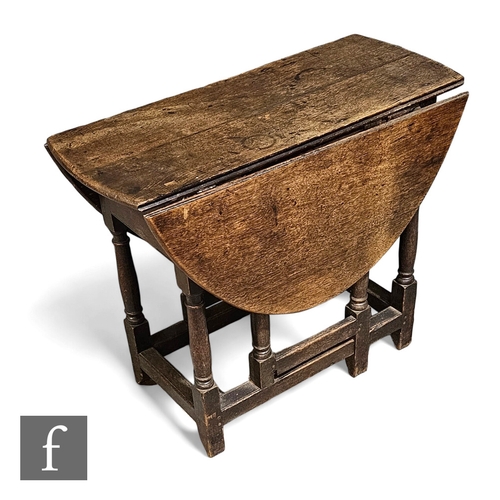 730 - A small 18th Century drop flap gateleg table on turned block legs and stretchers, height 71cm x dept... 