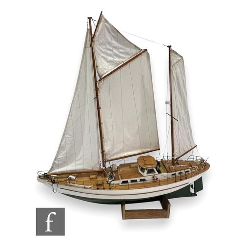 535 - A 20th Century wooden scale model of a two masted yacht named 'Mr CB', sails, white painted hull and... 