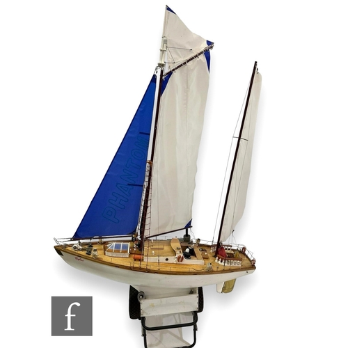 536 - A 20th Century scale model of a three masted yacht named 'Nykos', white painted hull with detachable... 