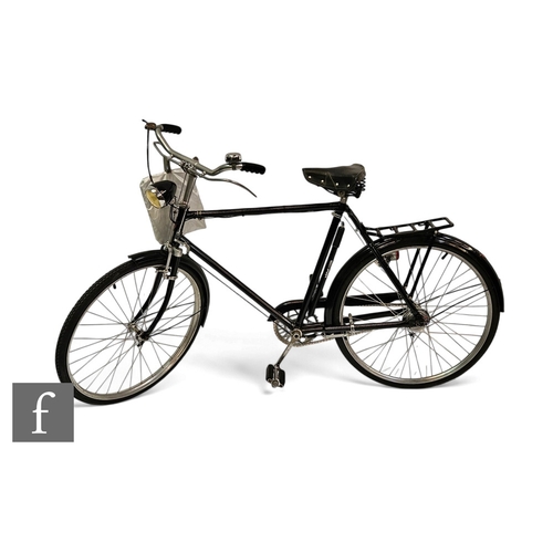 538 - A 1960s Dunelt bicycle, 24 inch spoked wheels, painted black, with Sturmey Archer three speed contro... 